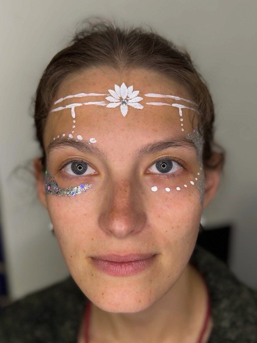 White flower and glitter festival face art