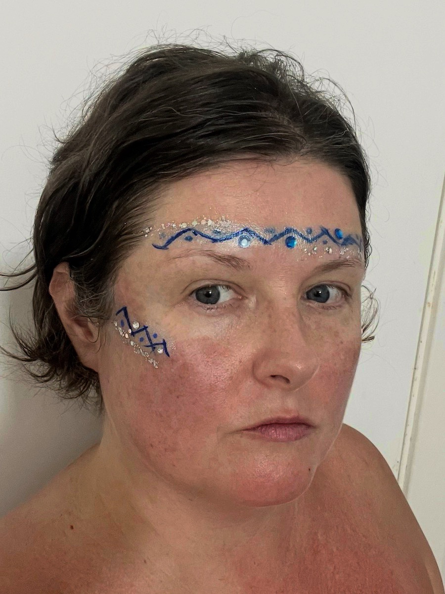 Blue wave gem and glitter face makeup