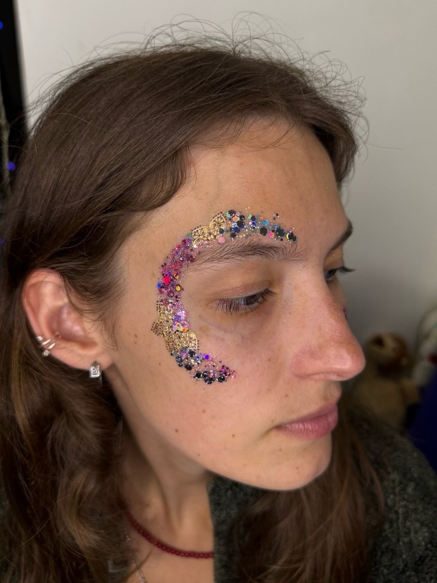 Multicolor crescent glitter face art