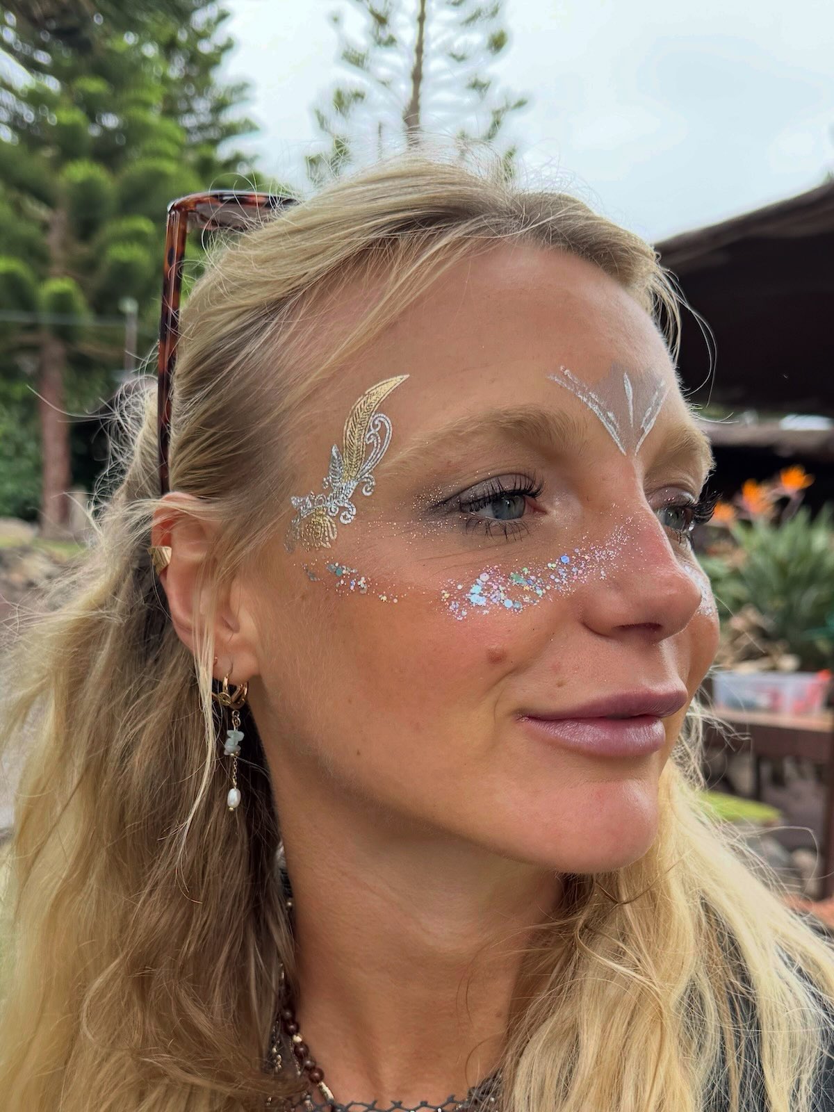 Gold butterfly and glitter outdoor festival makeup