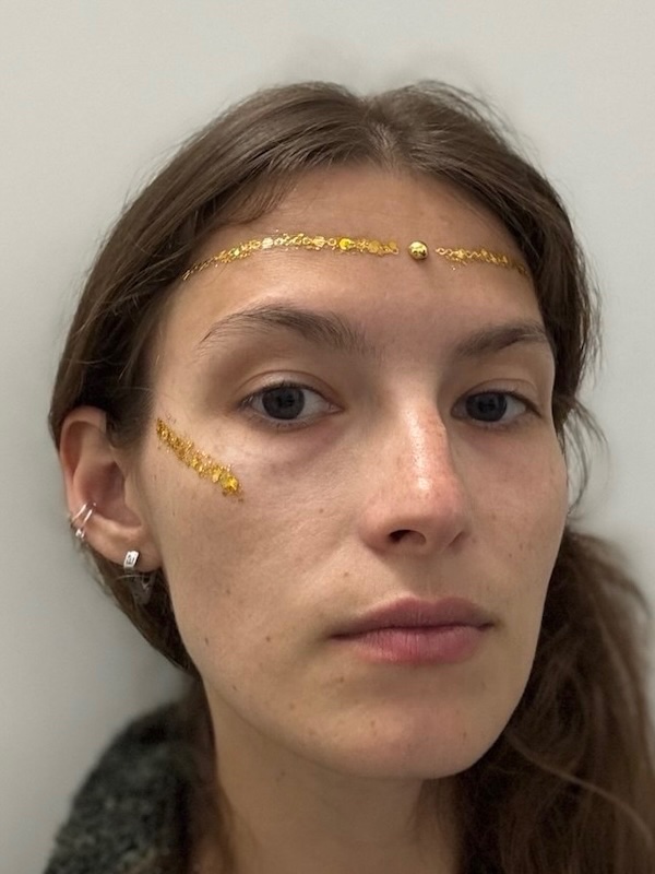 Gold glitter headband style face makeup