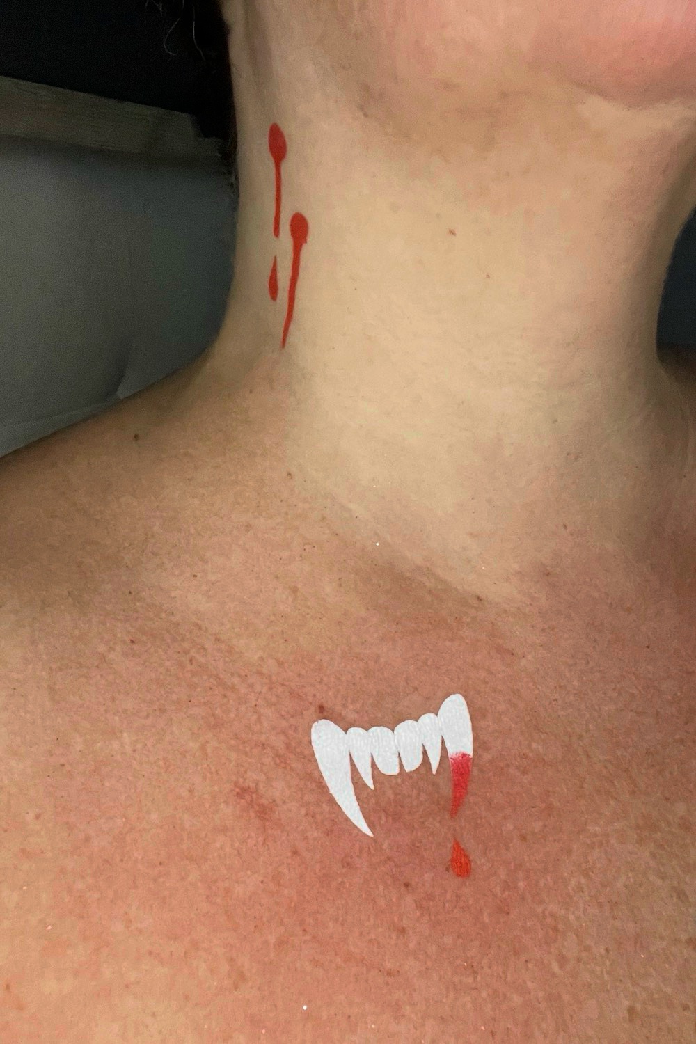 Fangs and blood drops body art